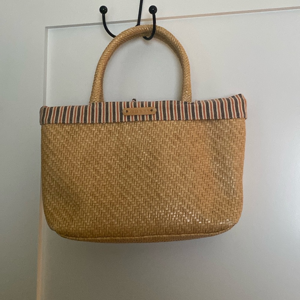 Guess straw handbag. Cute striped lining. Great condition!